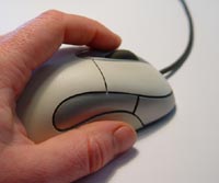 A hand using a mouse