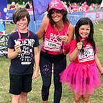 Deborah James with two children holding race for life medals