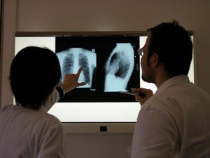 A photograph of Doctors looking at an X-ray