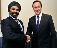 A picture of David Cameron and Harpal Kumar
