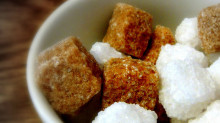 An image of brown and white sugar cubes