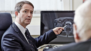 Doctor discussing a prostate cancer scan with patient.