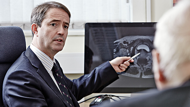 Doctor discussing a prostate cancer scan with patient.