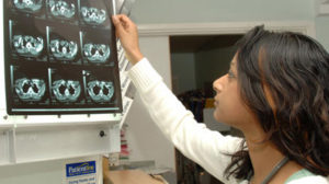 Image of a doctor analysing a scan.