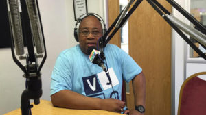 Alfred speaking on the radio.