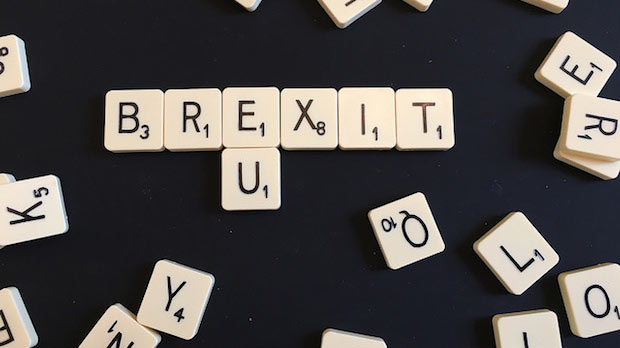 Scrabble pieces spelling Brexit.