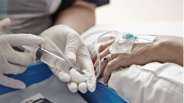 A chemotherapy line going into a patient's arm