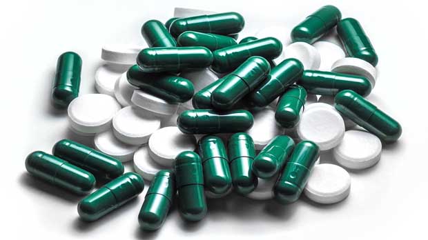 Green and white pills