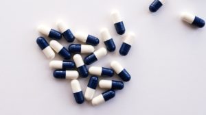A photo of some blue and white pills