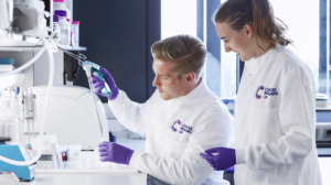 Two Cancer Research UK researchers in a lab