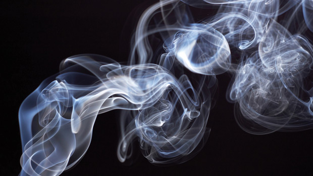 A cloud of smoke from a cigarette