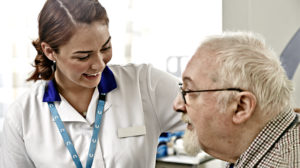 A female nurse with a male patient