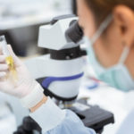 Medical technologist holding urine tube test in medical laboratory