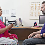 A patient having a consultation with their doctor
