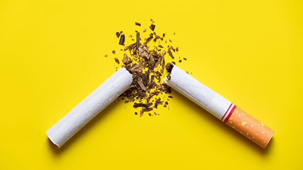 A photograph of a cigarette broken in half