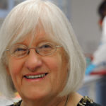 Headshot of Dame Valerie Beral in a lab