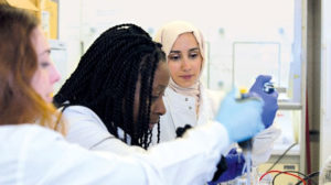 CRUK-funded researchers in the lab, among them Dr Mariam Jamal-Hanjani