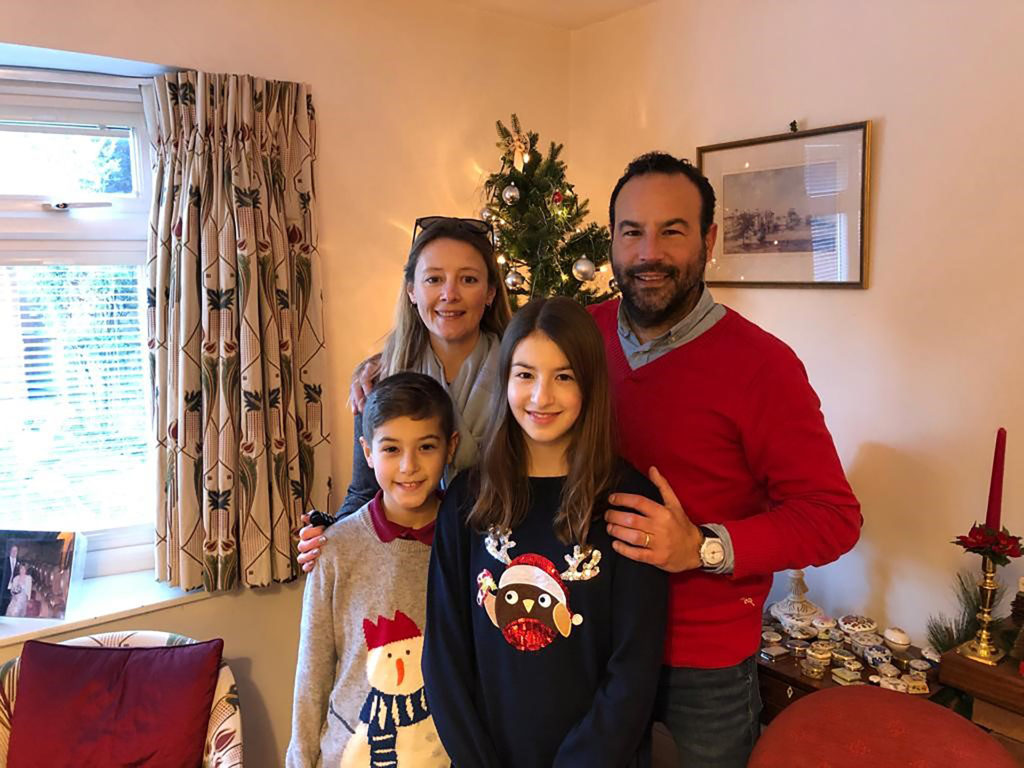 Alim, his wife and their two children at christmas