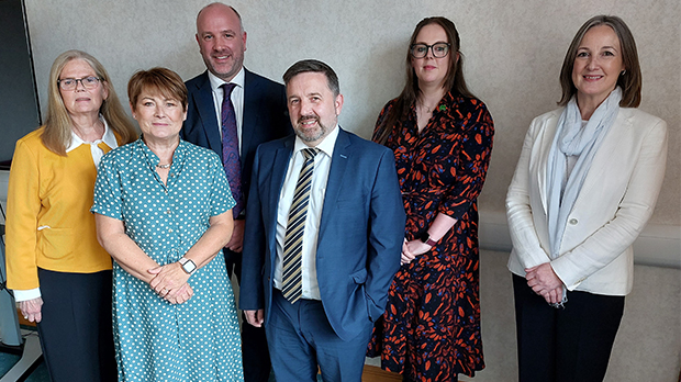 6 people standing in a room looking at the camera - Northern Irish charities meeting with Northern Irish health minister Robin Swann