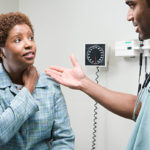 A black woman at a doctor's appointment