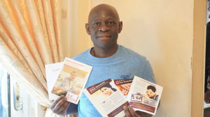 Kizi, who was diagnosed with breast cancer, with some of the information leaflets he was given