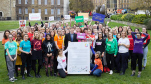 One Cancer Voice campaigners pictured with Steve Brine MP, Chair of the Health and Social Care committee, and a copy of the petition
