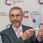 Alan Peace holding his Flame of Hope award