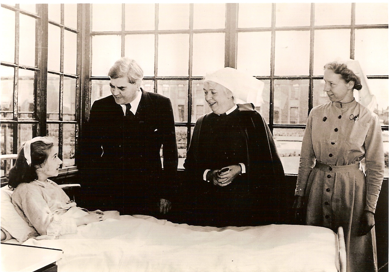 Aneurin Bevan, founder of the NHS, visits a patient on the service's first day.