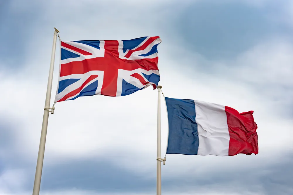 The flags of the UK and France flying side by side
