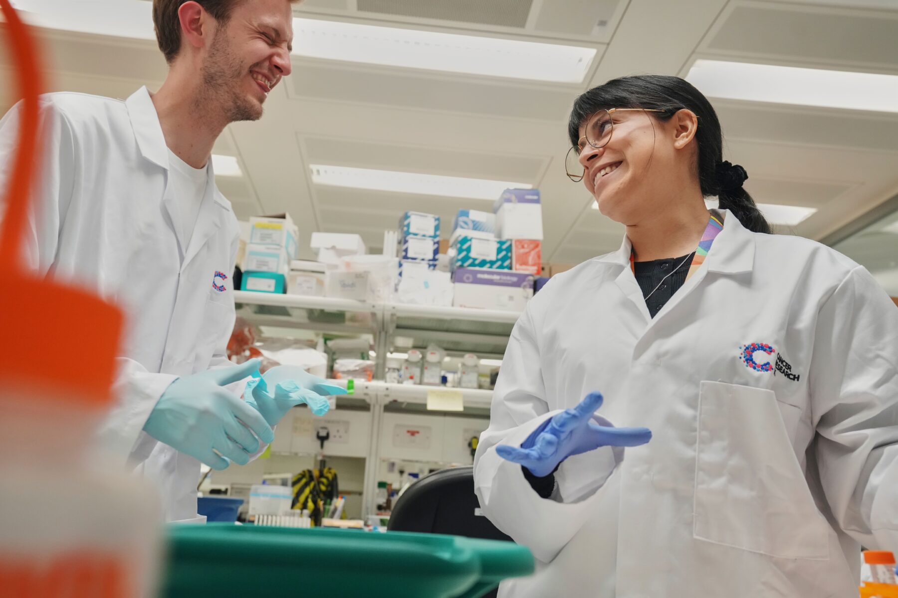 Two Cancer Research UK-funded researchers in their lab.
