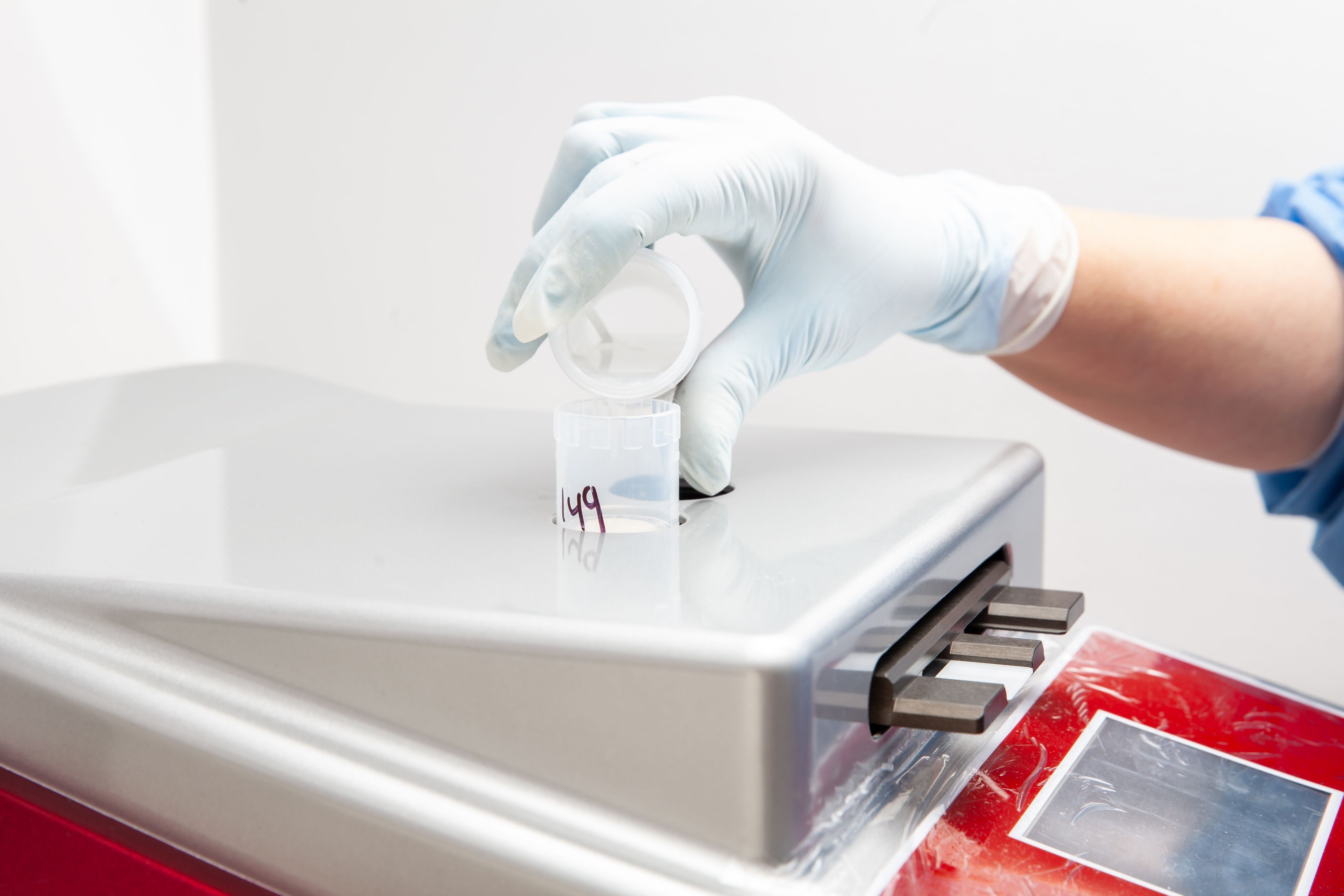 Scientist preparing microscope slides with liquid based cytology method