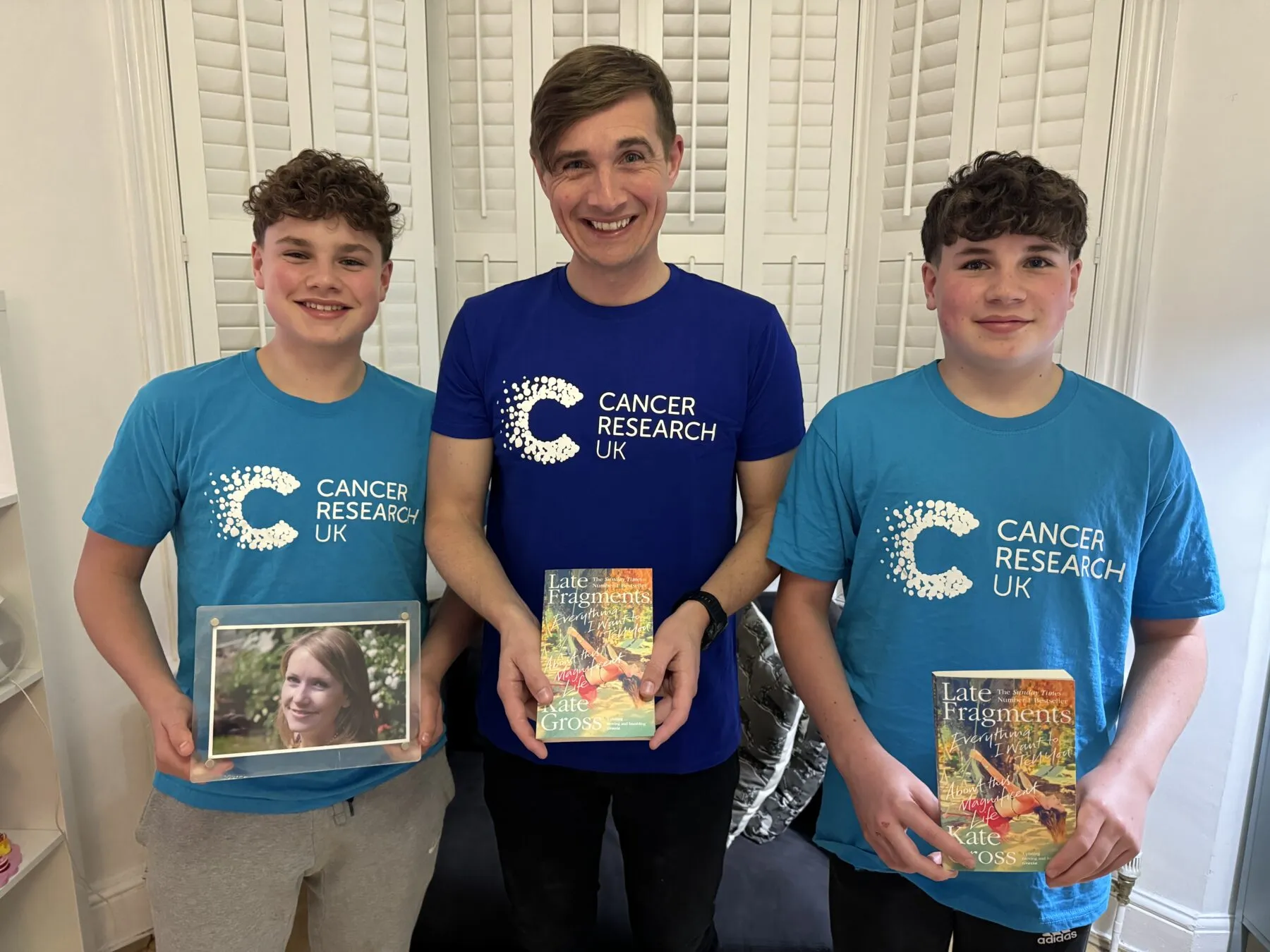 A picture of Billy with his twin sons wearing CRUK tshirts