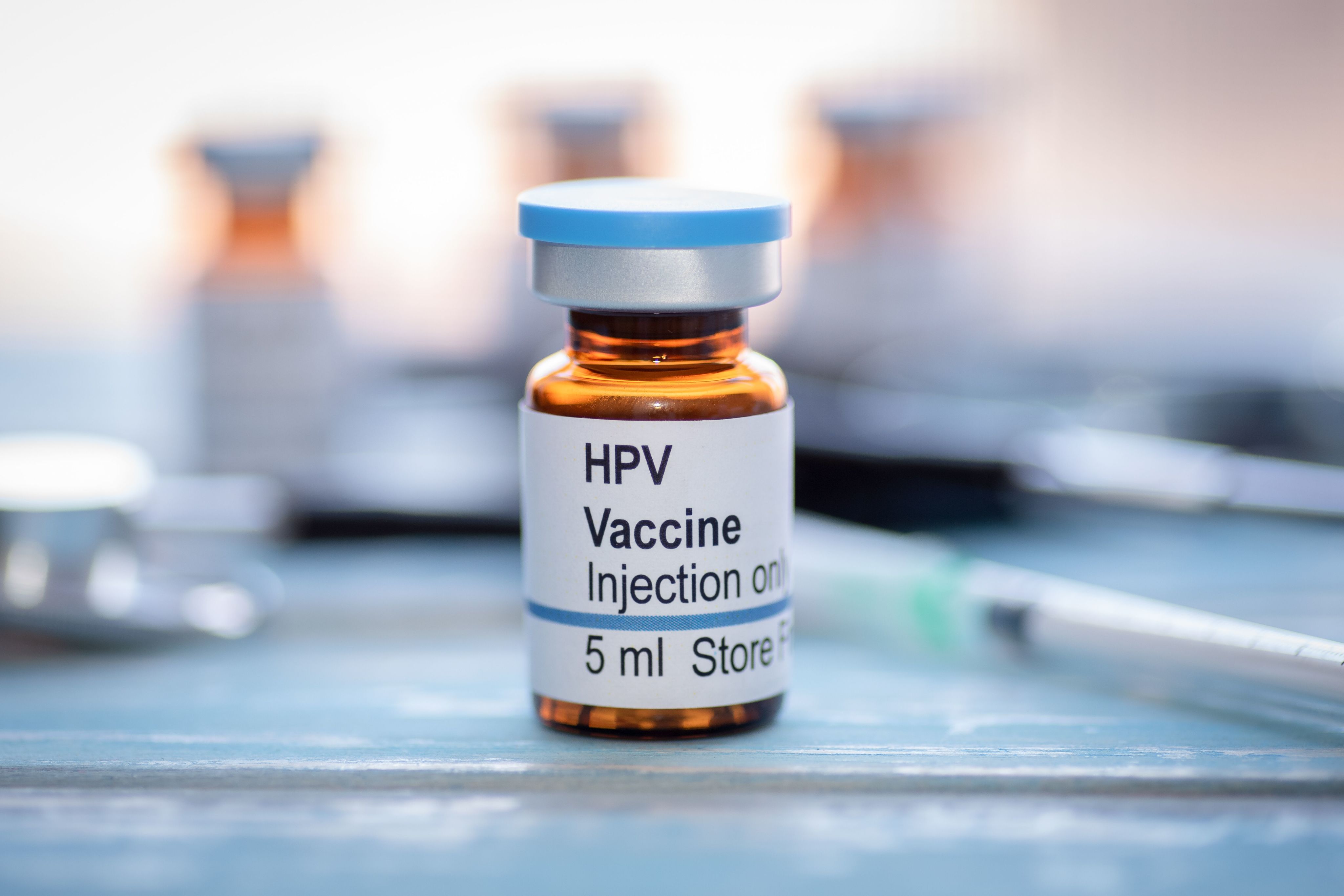 A vial containing a dose of the HPV vaccine
