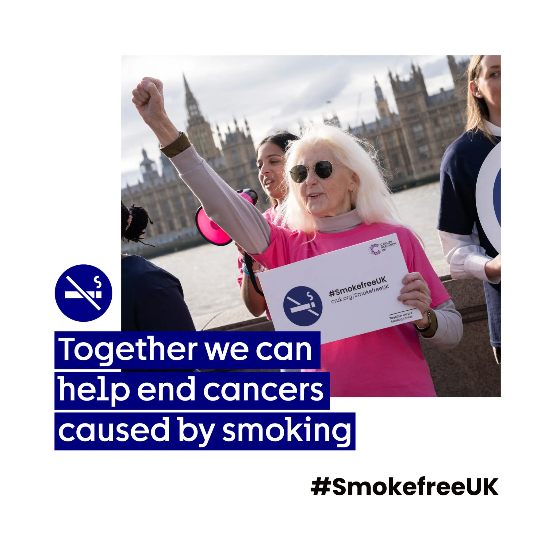 A woman holding a banner with the words 'Together we can help end cancers caused by smoking'