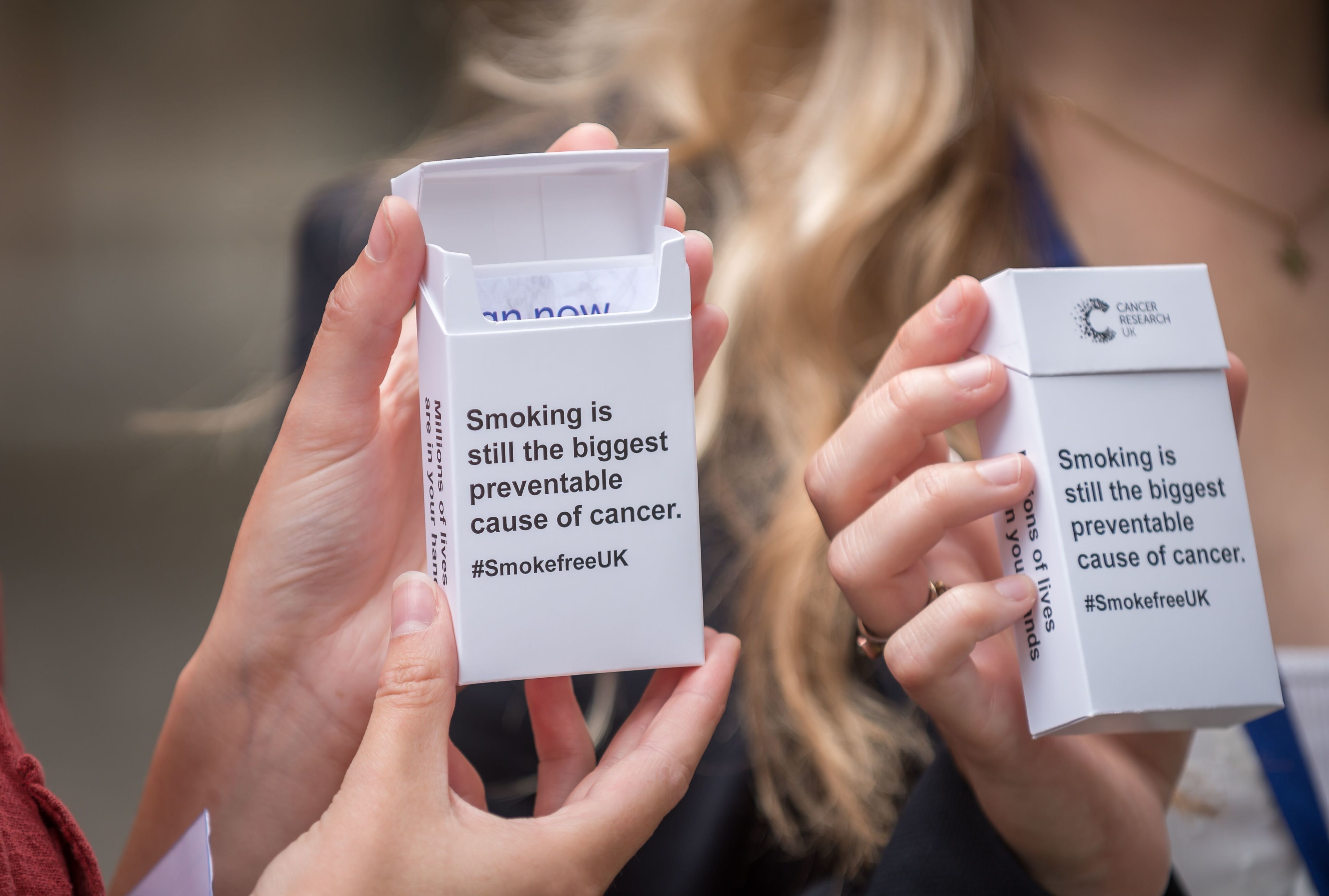 A cigarette package with the words 'smoking is still the biggest preventable cause of cancer. #SmokefreeUK'