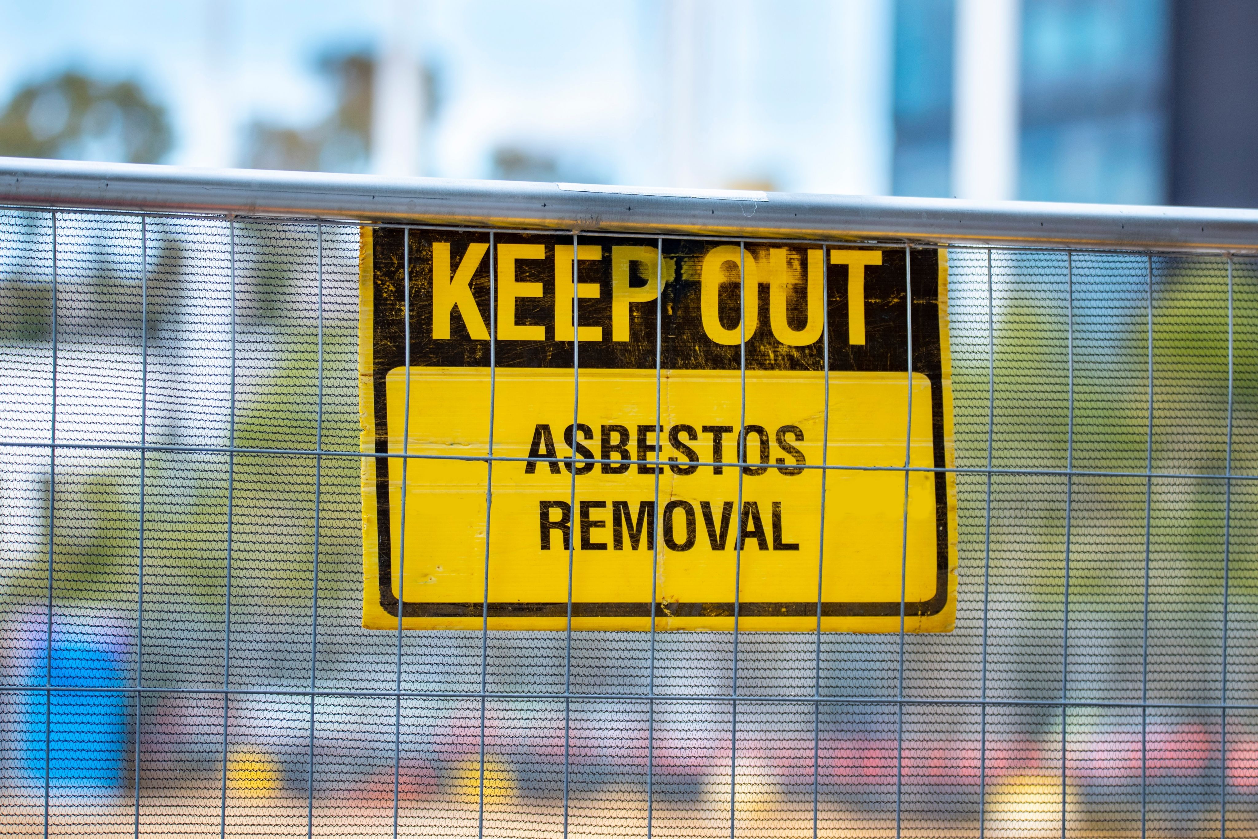 Warning sign with the words 'keep out, asbestos removal'
