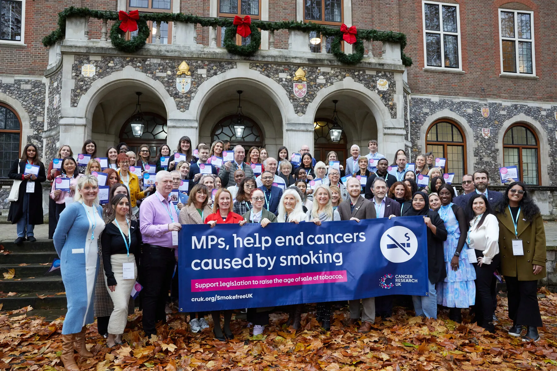 A group of Campaigns Ambassadors holding their signs in the air