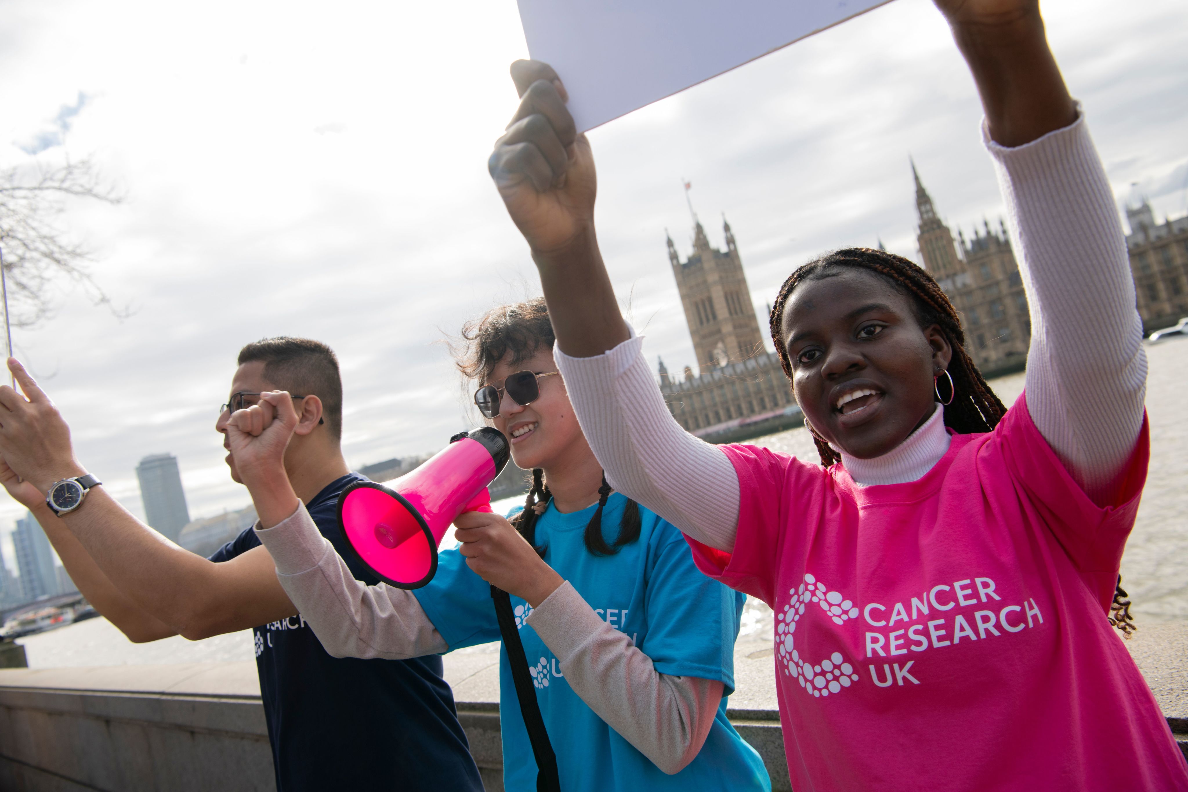 Campaigners standing across the river from westminster