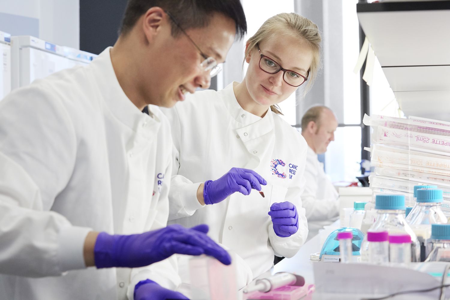 Cancer Research UK researchers working in a lab