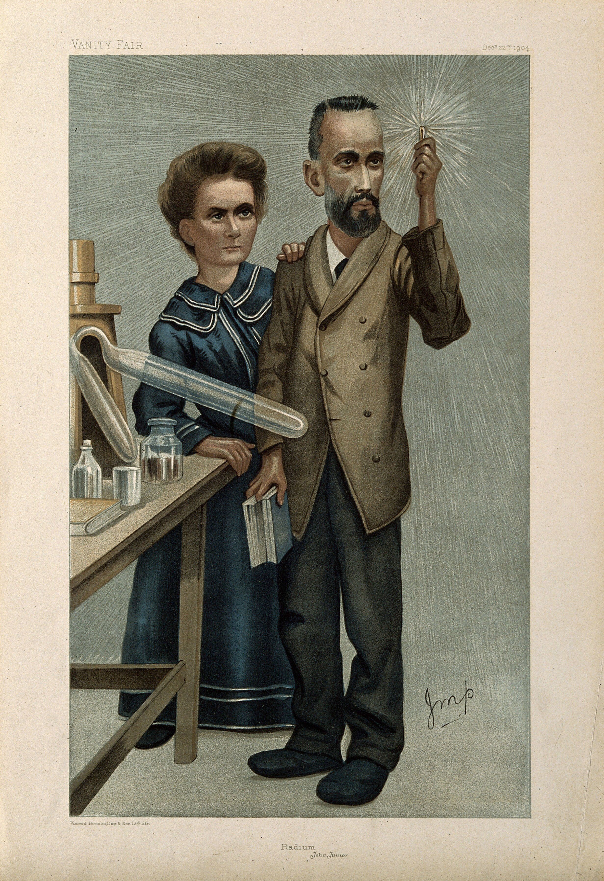A colour illustration showing Pierre and Marie Curie in their laboratory. Pierre Curie, dressed in a suit and overcoat, is holding a vial of glowing radium. Marie Curie, behind him in a long blue dress, has her hand on his shoulder. 