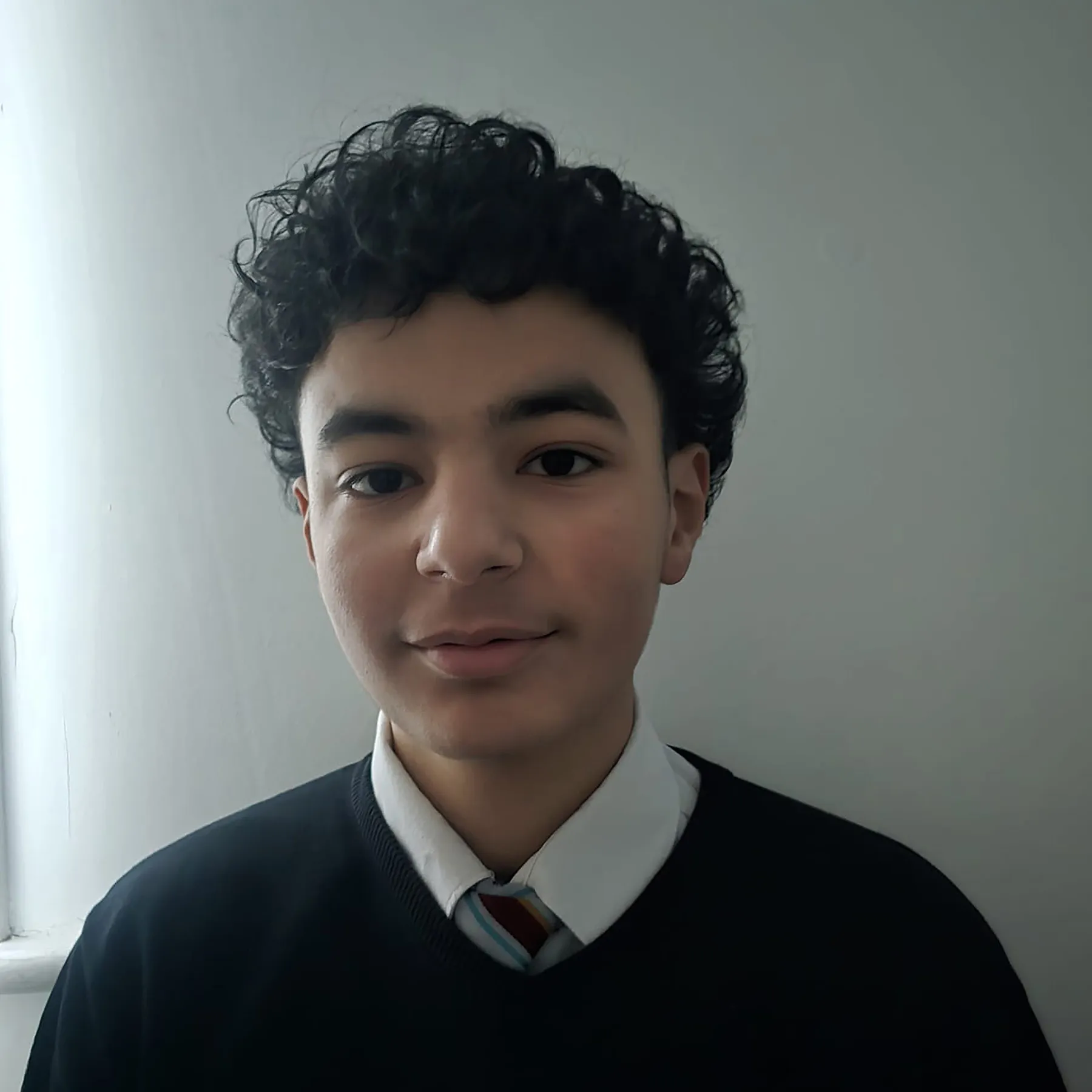 Zaid in his school uniform.