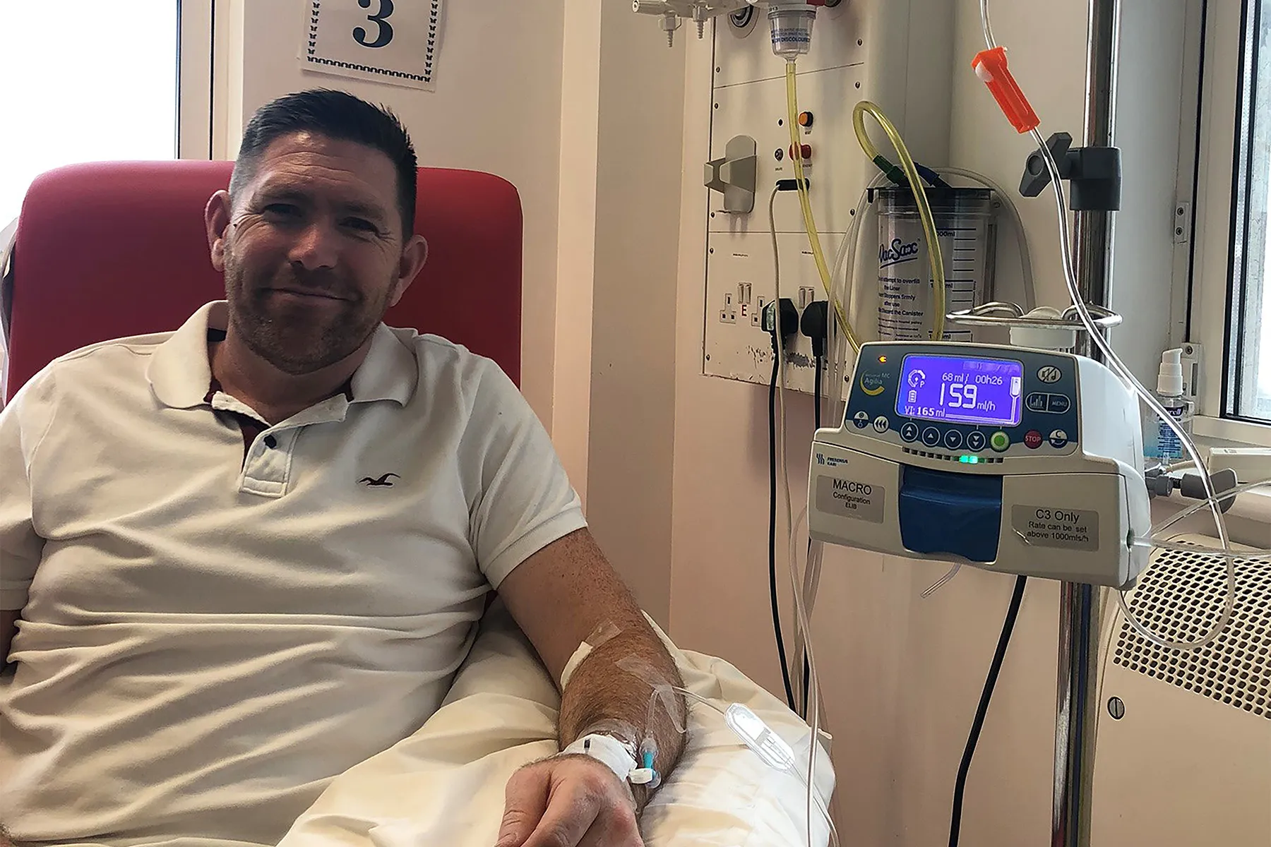 Shane sat in hospital receiving chemotherapy into his arm.