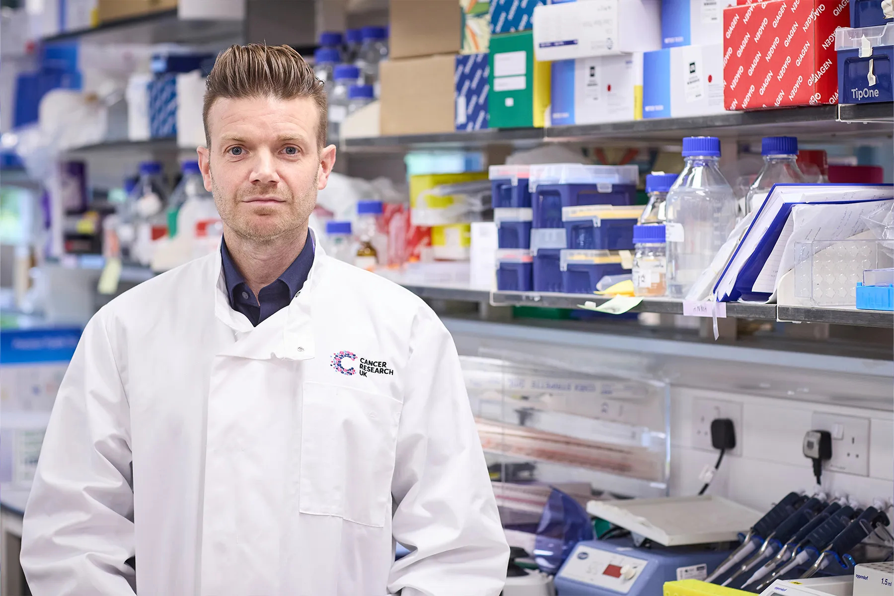 Richard Mair in the lab wearing a Cancer Research UK lab coat