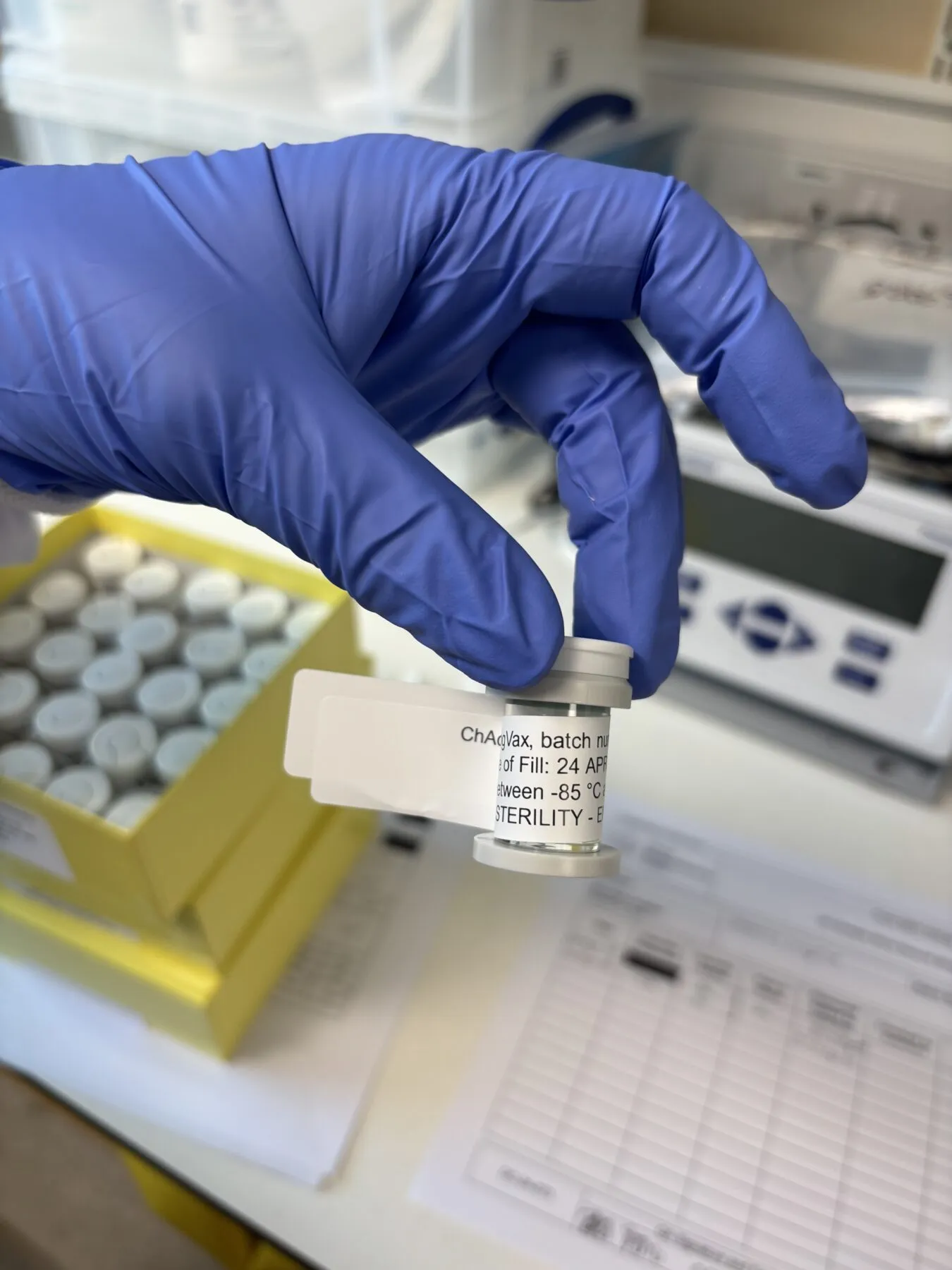 A close up shot of a vial of LungVax in a lab.