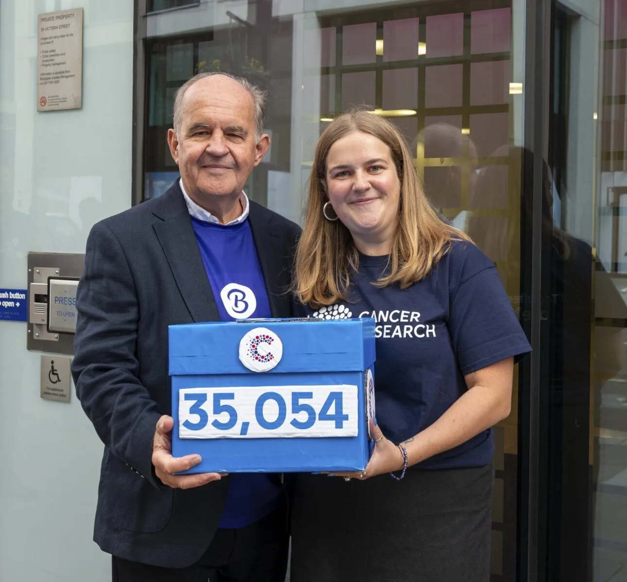 Alistair James and Campaigns Ambassador Alice deliver the signed open letter to DHSC.