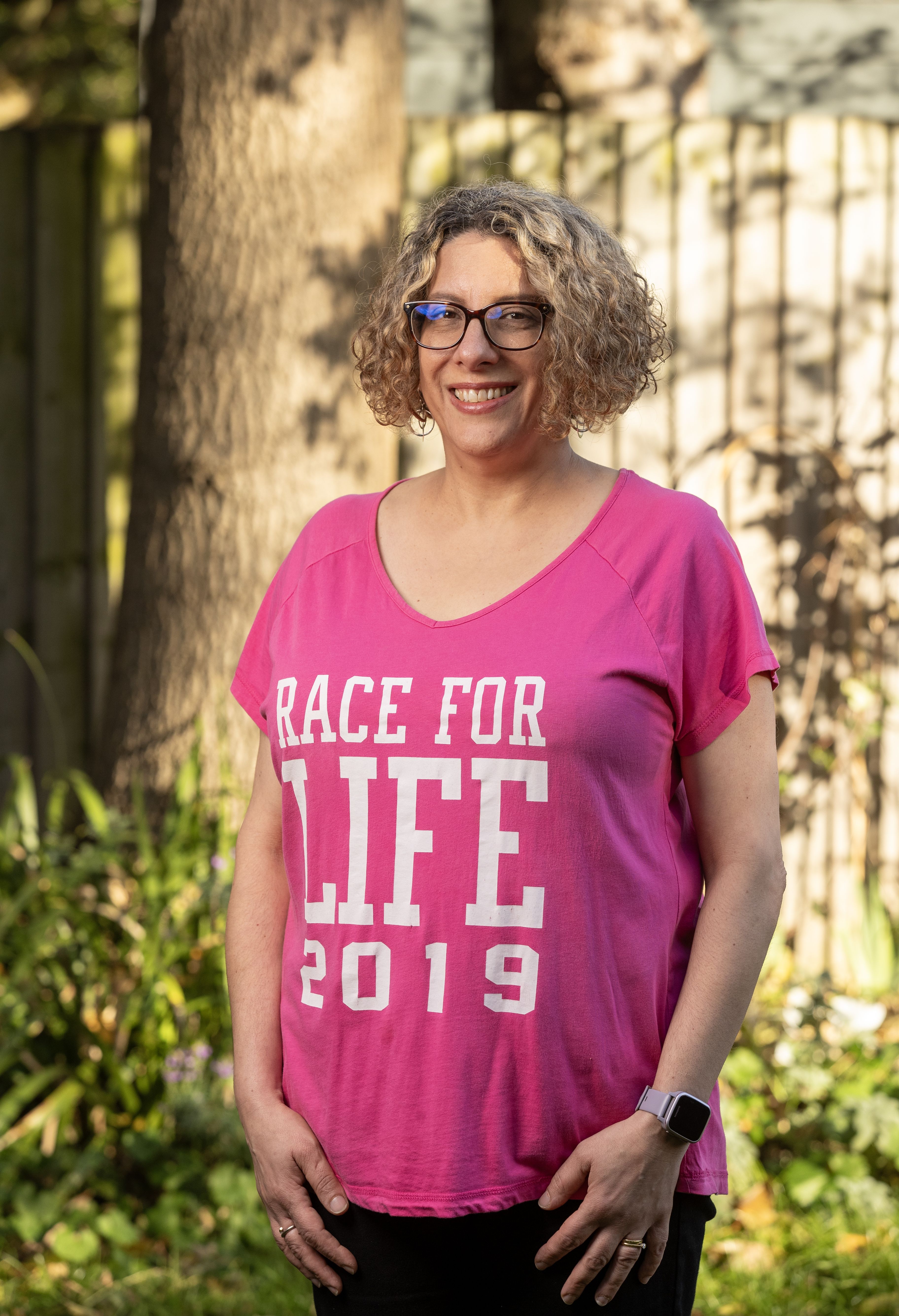 Lucy in a Cancer Research UK Race for Life t-shirt.